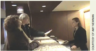 Write an email to a customer who posted negative feedback. Imagine that you work for the Colonnade Hotel and Resort, and a customer posted a video of his negative experience checking into the hotel (Figure). The customer also posted a negative review of the hotel on a travel website (Figure). Prepare an email to the customer, addressing his concerns. How can you win over this very angry customer?