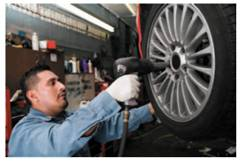 GUARANTEED HOURLY WORK Find the gross earnings for each employee by first finding the daily hourly earnings and then finding the daily piecework earnings. Each employee has an 8-hour workday and is paid $.75 for each unit of production or the hourly rate, whichever is higher. (See Example.) EXAMPLE Finding Earnings with a Guaranteed Hourly Wage Quick TIP The company guarantees that a tire installer will not earn less than $10.50 per hour or $84 1$10.50 • 82 for an 8-hour day. A tire installer at the Tire Center is paid $10.50 per hour for an 8-hour day or $1.15 per tire installed, whichever is higher. Find the weekly earnings for an employee having the following rate of production.