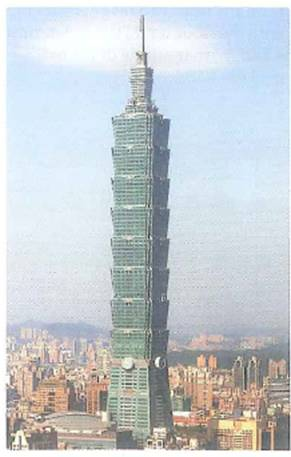 The Taipei 101 Tower in Taipei, Taiwan is a 509-m (1667-ft), 101-story building (Fig.). The outdoor observation deck is on the 89th floor, and two high-speed elevators that service it reach a peak speed of 1008 m/min on the way up and 610 m/min on the way down. Assuming these peak speeds are reached at the midpoint of the run and that the accelerations are constant for each leg of the runs, (a) what are the accelerations for the up and down runs (b) How much longer is the trip down than the trip up FIGURE A tall one The Taipei 101 Tower in Taipei, Taiwan, is a tall building with 101 stories. It has a height of 509 m (1671 ft). See Exercise.