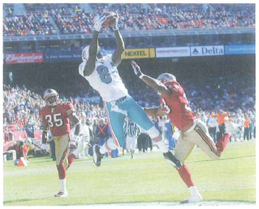 In football, good wide receivers usually have soft hands for catching balls (Fig.). Flow would you interpret this description on the basis of Newton's second law FIGURE Soft hands. See Conceptual Question.