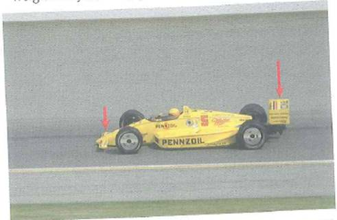 Shown in Fig. are the front and rear wings of an Indy racing car. These wings generate down force, which is the vertical downward force produced by the air moving over the car. Why is such a down force desired An Indy car can create a down force equal to twice its weight. Why not simply make the cars heavier FIGURE Down force See Conceptual Question.