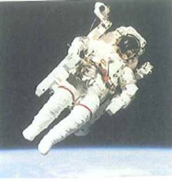 Astronauts in a spacecraft orbiting the Earth or out for a space walk (Fig.) are seen to float in midair. This phenomenon is sometimes referred to as weightlessness or zero gravity (zero- g ). Are these terms correct Explain why an astronaut appears to float in or near an orbiting spacecraft. FIGURE Out for a walk Why does this astronaut seem to float See Conceptual Question.