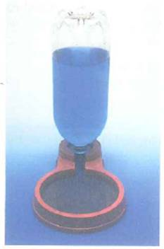 A water dispenser for pets contains an inverted plastic bottle, as shown in Fig. (The water is dyed blue for contrast.) When a certain amount of water is drunk from the bowl, more water flows automatically from the bottle into the bowl. The bowl never overflows. Explain the operation of the dispenser. Does the height of the water in the bottle depend on the surface area of the water in the bowl FIGURE Pet barometer See Conceptual Question.