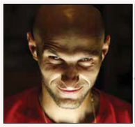 What Is a Psychopath? Jeffrey Dahmer would pick up young gay men, bring them home, drug them, strangle them, have sex with their corpses, and then, in some cases, eat their flesh. Dennis Rader would break into people's homes, tie them up, strangle them, and eventually murder them. His murder method earned him the name BTK killer, which stands for Bind, Torture, and Kill. Dahmer and Rader are superficially charming, unemotional, impulsive, and self-centered. They are pathological liars who constantly manipulate others. Also, both men completely lack remorse, guilt, and empathy. Finally, they have low self-esteem and a lifelong sense of loneliness. However, not all psychopaths are serial killers. Other types of psychopaths include the corporate psychopath, the con artist, and the chronic offender. A corporate psychopath may swindle investors out of billions of dollars. The con artist may pass himself off as a doctor, attorney, or police officer to deceive and manipulate others. The chronic offender is persistently in trouble with the law and gets rearrested soon after he is released. What may seem surprising is that psychopaths can love their family members but have great difficulty loving the rest of the world. Rader, for instance, was a loving husband and father. Yet, he seemed completely devoid of humanity as he plainly recounted the details of how he murdered his many victims. Some of the fascinating characteristics and behaviors of psychopaths may be explained by biological and neurological factors. For example, some psychopaths have abnormalities in their limbic system, which is responsible for motivational behaviors, such as eating and sex, as well as emotional behaviors, such as fear and anger. Also, some psychopaths have a disruption in the communication between the hippocampus and the prefrontal cortex, which is believed to contribute to their inability to regulate aggression and their insensitivity to cues that predict they will get caught and punished. Interestingly, psychopaths also have lower autonomic arousal and consequently experience less distress when exposed to threats. The life histories of psychopaths often include a chaotic upbringing, lack of parental attention, parental substance abuse, and child abuse. These life experiences may interact with biological or neurological factors linked to psychopathic behaviors. In other words, at least for some children, the consequences of having a stressful childhood can be deadly. Question Which trait theory can explain how an individual can display such drastically inconsistent behaviors?