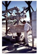 <strong>The photograph shown below is that of a water well casing in California. When groundwater was withdrawn, the ground surface dropped, leaving part of the well exposed above ground.    -What likely happened to the porosity of the aquifer when this occurred?</strong> A) Porosity probably decreased to compaction. B) Porosity probably increased due to compaction. C) Porosity probably did not change. <div style=padding-top: 35px> 