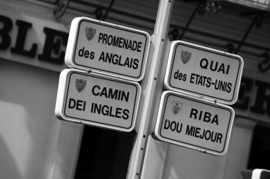 <strong>In Montreal, Quebec, Canada, signs posted in public view (such as for streets or restaurants) are required to show the words in French first, usually above English, and in larger type sizes. This reflects: </strong> A) the language continuum. B) that there are more French speakers in Canada than English speakers. C) the use of political power to control language use. D) an interest in welcoming both French and English speakers.