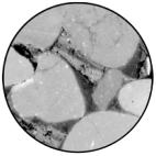 What is the purpose of the cement surrounding the grains in the photo?