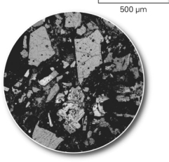The picture below shows a(n)________ of rock that geologists use to determine the minerals in the rock.
