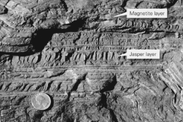 <strong>Consult the figure below.These iron ore deposits,which started as sedimentary layers,are known as ________. </strong> A)banded iron formations B)jasper beds C)manganese nodules D)bauxite