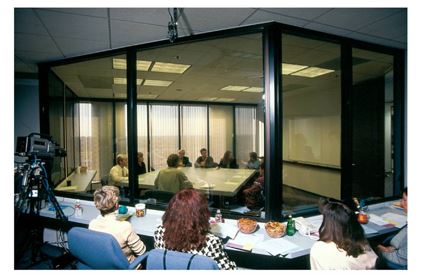-Consider the Marketing Research Method Photo above. What type of marketing research method is most likely being represented here, with observers behind a one-way mirror watching a discussion among people about topics of interest to marketers?