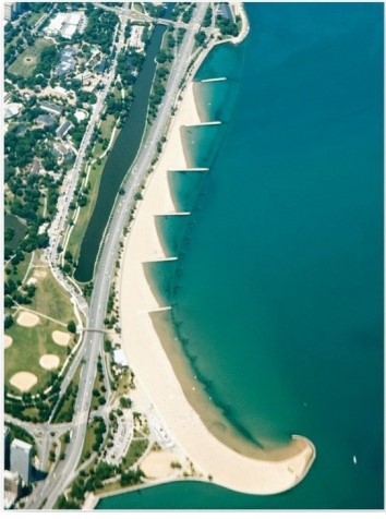 <strong> Which are these features,here from Lake Michigan,that disrupt sediment movement along a coast?</strong> A)Breakwaters. B)Groins. C)Jetties. D)Tombolos.