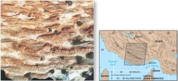 <strong>  The Zagros mountains of Iran is an example of</strong> A) a series of faulted mountain blocks. B) a zone of tension. C) a zone of shearing motions. D) a zone of compression and folding. <div style=padding-top: 35px> 