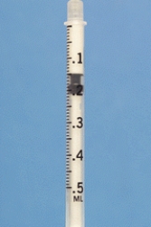 Identify the dosage measured on the syringe.