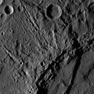 The image below shows the surface of a planet in our Solar System,which is covered by linear structures and craters similar to those shown here.Which one is it?