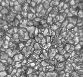 <strong>Which of the following is true of the solar surface features seen in the image below? </strong> A) The patterns are created in the chromosphere. B) The dark spots have a higher temperature than the light spots. C) The patterns are created by magnetic field variations. D) The light spots have blueshifted absorption features.