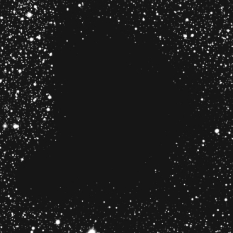 <strong>What is the most likely explanation for the dark area in the image below? </strong> A) It is a region where there are no stars. B) It is a region with lots of dark matter. C) It is a super-massive black hole. D) It is a region with thick dust blocking the starlight coming from behind. E) It is a dark star cluster.