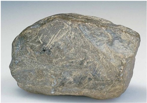<strong>  This cobble shows prominent scratches because ________.</strong> A)it was tumbled in a stream B)it was scraped against other rocks in a glacier C)it was blasted by wind D)this was its shape when it was mechanically weathered from its source rock <div style=padding-top: 35px> 