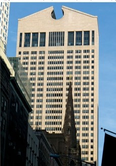 <strong>The building on the right within the figure </strong> A)is more modernist, because of its squarish, rectilinear shape. B)is more post-modernist because of its odd angles and shapes. C)is more structuralist because the underlying steel cannot be seen. D)is more Marxist because this building led to worker revolt.
