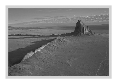 <strong>A volcanic neck,such as that seen at Shiprock,New Mexico (below),is a(n)____________. </strong> A) sheet-like intrusion that lies parallel to surrounding layers of sedimentary rock B) cooled layer of lava C) intrusion formed within a volcano D) sheet-like intrusion that cuts across preexisting layers