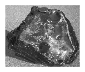 <strong>Obsidian,shown below,____________. </strong> A) is volcanic glass B) possesses conchoidal fracture C) typically is felsic in composition D) All of the above are correct.