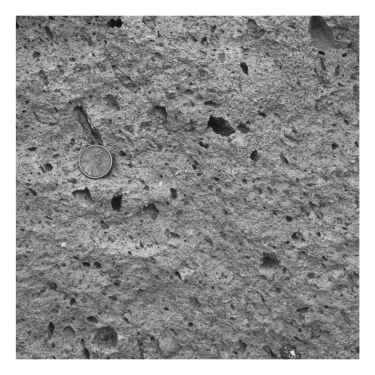 <strong>A volcano emits ash,which falls from the sky,settles in layers,and is eventually cemented.The resulting rock is termed ____________. </strong> A) pumice B) granite C) tuff D) ignimbrite