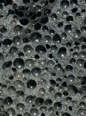 <strong>The figure below is an igneous rock with what kind of texture? Hint: Do not be confused by the holes. </strong> A)glassy B)aphanitic C)phaneritic D)porphyritic E)groundmass