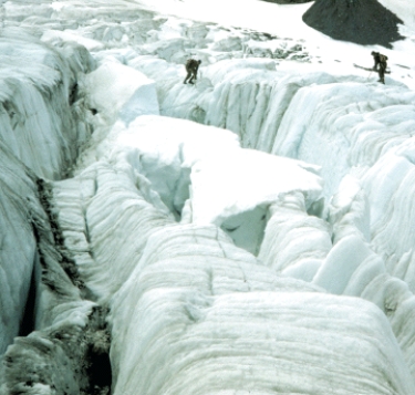 Stresses in the brittle surface layer of glacial ice cause cracks as seen in the photograph,which become _____.