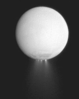 What material has been seen erupting from the surface (see the image below)of the icy moon Enceladus,and why?