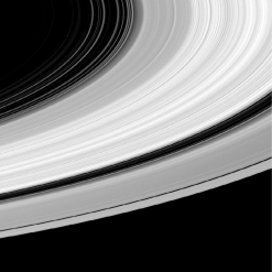 <strong>How does the thickness of Saturn's bright ring system compare to its diameter? </strong> A) It's about 10 times thinner. B) It's about 1,000 times thinner. C) It's about 100,000 times thinner. D) It's about 10 million times thinner.