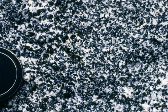 <strong>Which of the following photographs depicts an igneous rock where the magma cooled slowly at first and then had fast cooling?</strong> A) B) C) D)