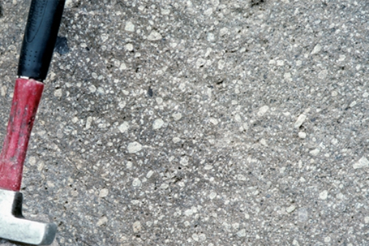 <strong>Which of the following photographs depicts an igneous rock where the magma cooled slowly at first and then had fast cooling?</strong> A) B) C) D)