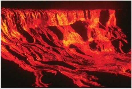 <strong>Comparing these two photographs,which eruption has lower viscosity magma? </strong> A)The fluid cascade of lava B)The circular volcanic feature C)They could have the same viscosity. D)There is no way to tell.