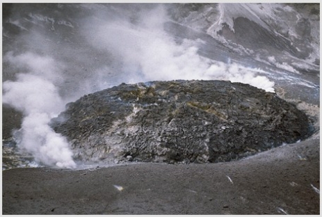 <strong>Comparing these two photographs,which eruption has lower viscosity magma? </strong> A)The fluid cascade of lava B)The circular volcanic feature C)They could have the same viscosity. D)There is no way to tell.
