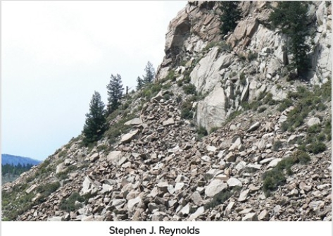 <strong>Which of the following surface environments is the most likely site for deposits in this photograph?  </strong> A)Steep mountain front B)River channel C)Sand dunes D)Beach E)Lake <div style=padding-top: 35px> 