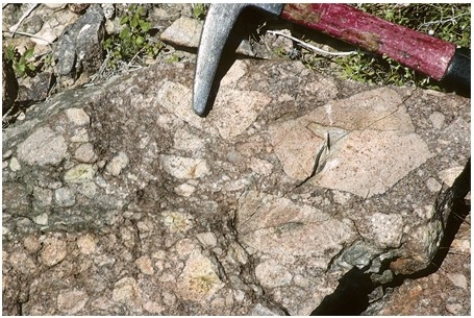 <strong>What texture is displayed by the igneous rock in this photograph?  </strong> A)Vesicles B)Breccia C)Porphyritic D)Glassy E)None of these are correct. <div style=padding-top: 35px> 