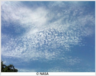 <strong>The high-level cloud pictured here consists mainly of ice crystals and is due to convection </strong> A)cumulonimbus. B)cirrocumulus. C)altocumulus. D)cumulus.