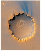 <strong>The presence of dunes in the middle Victoria Crater on Mars indicates that:  </strong> A)Mars has an atmosphere B)volcanic eruptions produced abundant sand C)glaciers once covered most of Mars D)seas once covered this area,leaving behind the dunes <div style=padding-top: 35px> 
