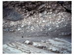 <strong>This photograph shows an upper unit with fragments and a lower unit with tilted layers.Which of the following statements is true? </strong> A)the upper unit is younger because it is on top B)the upper unit is younger because it contains pieces of the underlying unit C)the lower unit is older because it was tilted and eroded before deposition of the upper unit D)all of these