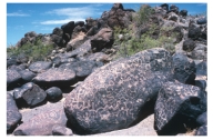 <strong>What kind of geologic feature is shown in this photograph? </strong> A)contact metamorphism B)unconformity C)desert varnish D)desert pavement E)none of these