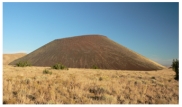 <strong>What types of rocks would be most common in the small volcano in this photograph? </strong> A)scoria and other vesicular basalt B)basalt mostly formed in lava flows C)felsic and intermediate lava flows D)welded tuff and tephra E)none of these