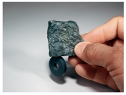 <strong>What mineral test is shown in this photograph? </strong> A)scratch test B)effervescence C)streak D)magnetism E)specific gravity