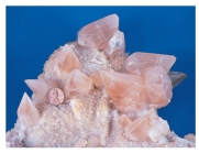 <strong>What does the shape of these crystals indicate about the environment in which they formed? </strong> A)They formed at great depth and under very high pressures. B)They formed from cold water that was moving rapidly through the rocks. C)They formed into a space filled with water rather than solid rock. D)They grew during an explosive volcanic eruption.