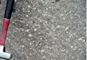 <strong>Which of the following photographs depicts an igneous rock where the magma cooled slowly at first and then had fast cooling?</strong> A) B) C) D)