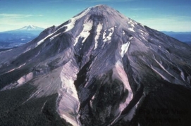 <strong>The typical shape of most volcanoes, including the one shown here, is: </strong> A) conical B) cylindrical C) domical