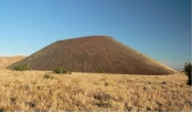 <strong>What types of rocks would be most common in the small volcano in this photograph? </strong> A) scoria and other vesicular basalt B) basalt mostly formed in lava flows C) felsic and intermediate lava flows D) welded tuff and tephra E) none of these