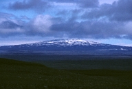 <strong>What is a main hazard of this type of volcano? </strong> A) hot fragments thrown a short distance from the volcano B) burning, building collapse, and suffocation from widely distributed pyroclastic material C) destruction by moderately fluid lava flows that can flow far from the volcano D) volcanic mudflows and landslides E) relatively small pyroclastic eruptions caused by localized explosions or collapse
