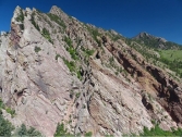 <strong>What type of deformation is shown in this photograph? </strong> A) displacement B) rotation C) internal strain of the rock D) columnar joints