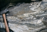 <strong>Under what conditions was this rock likely deformed? </strong> A) relatively shallow B) brittle conditions C) conditions that favored fracturing D) hot and deep conditions