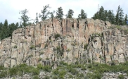 <strong>What type of structure is expressed in this cliff face? </strong> A) normal faults B) reverse faults C) joints D) folds