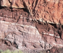<strong>What type of structure is shown in this photograph? </strong> A) joint B) cleavage C) fault D) anticline E) syncline
